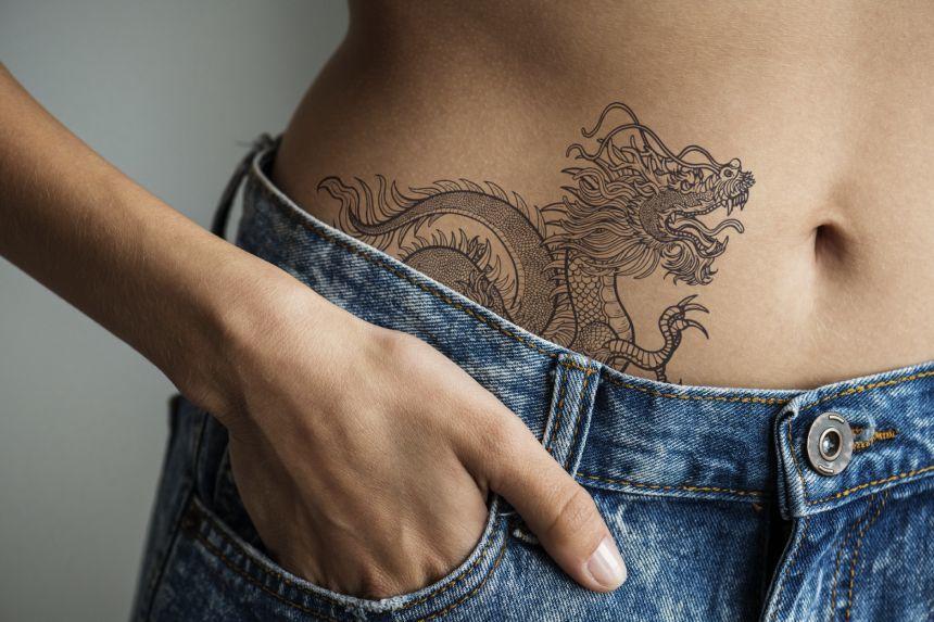Что означает татуировка дракона у девушки?